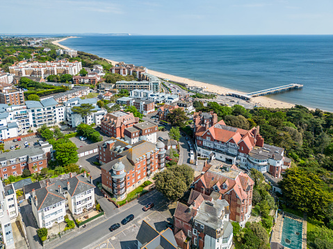 Bournemouth, UK. 22 May 2023. Aerial view of housing at Boscombe Beach in Bournemouth with view of the pier.