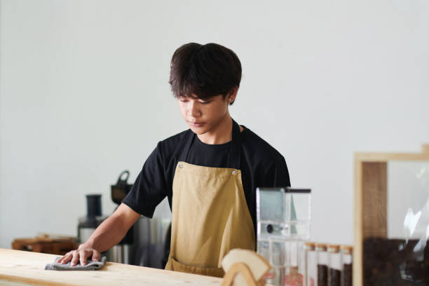 istock Barista Cleaning Counter 1492698373