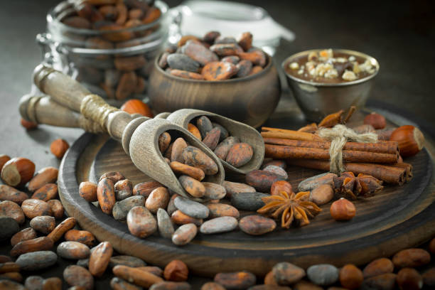 istock Cocoa beans on an old background. 1492699179