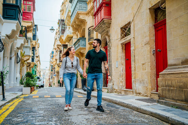 Young couple enjoying a walk in Valletta, Malta stock photo