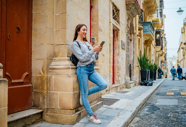 istock Woman tourist using phone in Valletta, Malta 1492700063