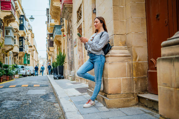istock Woman tourist using phone in Valletta, Malta 1492700110