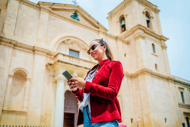 istock Young woman using phone in Valletta, Malta 1492700796