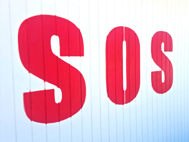istock red SOS symbol on white wood 1492702338
