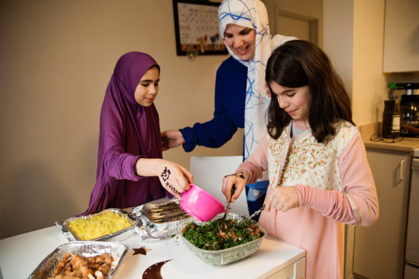 istock North-american muslim mother and daughters preparing Iftar at Ramadan. 1492704577