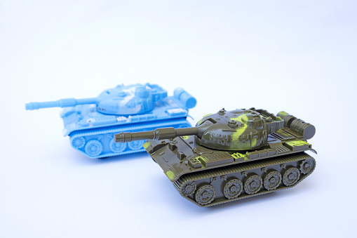 Two toy tanks photographed on a white background