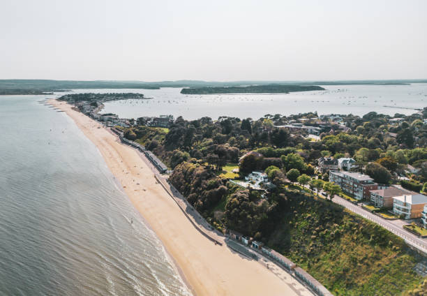 Canford Cliffs towards Sandbanks Aerial view from Canford Cliffs towards Sandbanks, with Brownsaea Island sandbanks poole harbour stock pictures, royalty-free photos & images