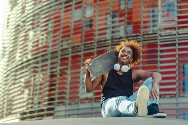istock Young urban African American man with a skateboard 1492717895