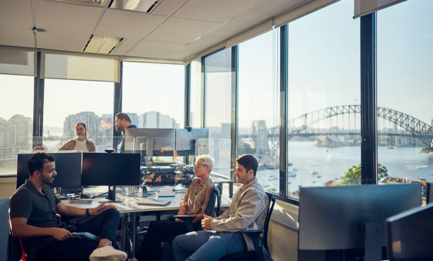 istock Colleagues from diverse backgrounds working together harmoniously in an Australian office. 1492719654