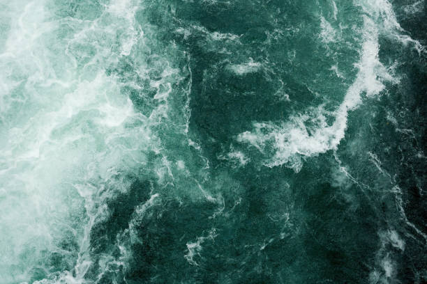 istock Pattern of blue stormy water surface with white waves and splashes 1492720293