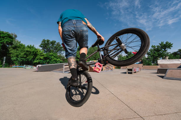 istock A mature tattooed unrecognizable man in action is practicing on his bmx for the X-games in a skate park. 1492720342