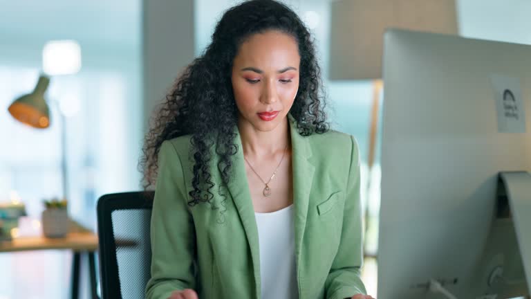 Concentration, search and computer with black woman in office for email, planning, and online news at night. Browsing, focus and administration with employee for professional and corporate company