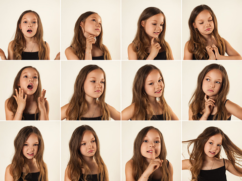 Collage set of shots with diverse facial expressions little girl. Emotional pretty kid child posing at white background on blank studio wall, showing emotions. Childhood emotion concept. Copy ad space