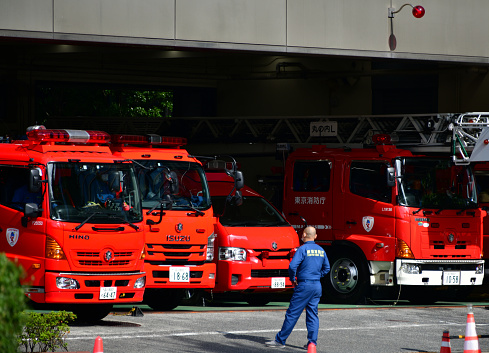 Tokyo, Japan: Tokyo Fire Department (TFD), serves Tokyo Metropolis, the TFD is the largest urban fire department in the world - fireengines and emergency vehicles at the fire station garage - Otemachi, Chiyoda.