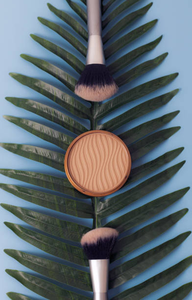 conjunto de cosméticos femininos com ramo de palmeira em um fundo azul. - beautiful outdoors vertical close up - fotografias e filmes do acervo