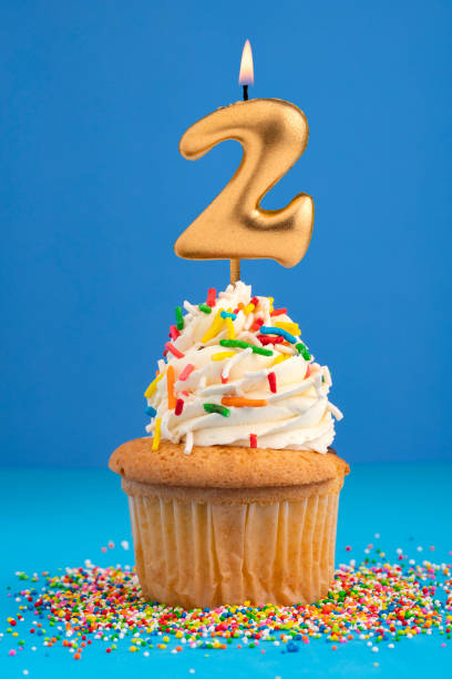 istock Candle number 2 - Cake birthday in blue background 1492733949