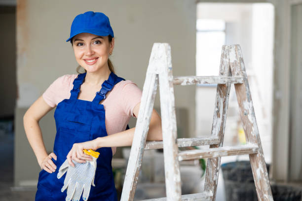 Female worker posing in apartment being renovated