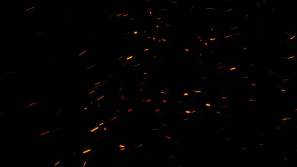 Photo of Burning ash background. Sparks backdrop. Flickering abstract Particles