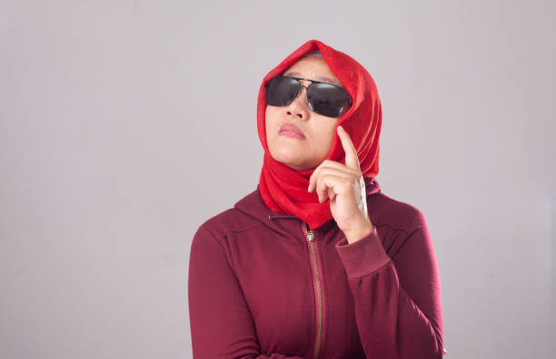 istock Muslim Lady in Red Thinking Something 1492740057