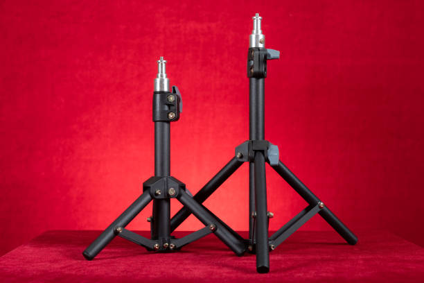 two light stands for photography on red background at horizontal composition