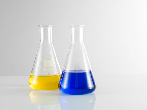 Scientific Measuring Beakers With Colorful Liquid