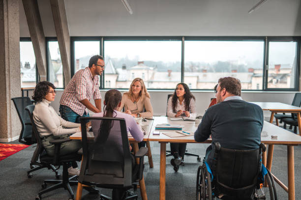 istock Inside a Bright Office, Business Meeting with Big Team 1492754769