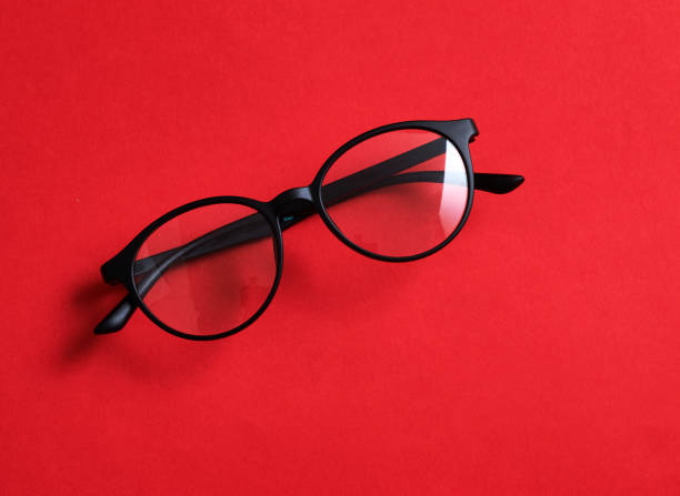 istock Black frame glasses isolated on red background for the poster design 1492756017