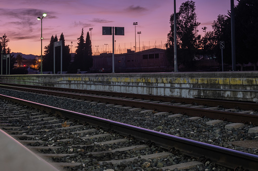 View of tracks at the train station in Ronda at night.