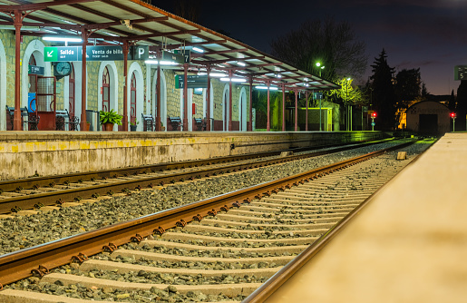 View of tracks at the train station in Ronda at night.