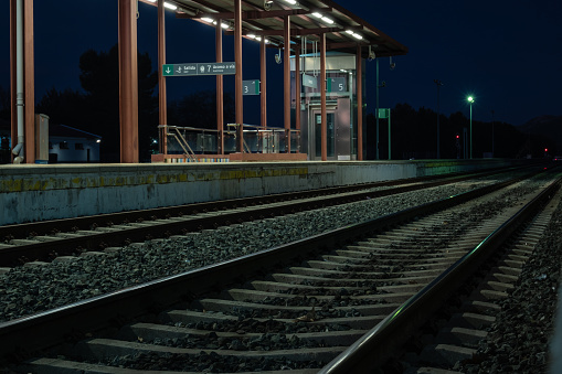 View of tracks at the train station in Ronda at night.