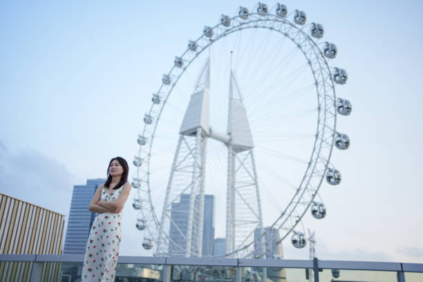 istock girl and city ferris wheel 1492767545