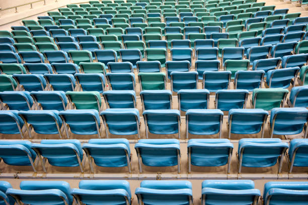 istock Empty seats in the stadium for fans with blue chairs 1492775884