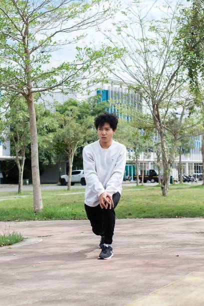 istock indonesian young men doing stretching exercise at city park 1492776513