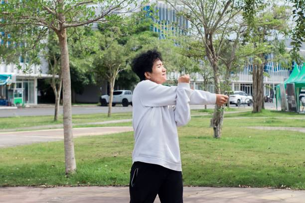 istock indonesian young men doing stretching exercise at city park 1492776525
