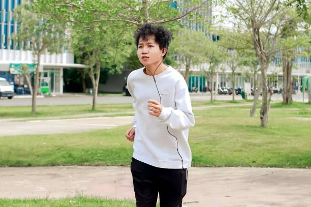 istock indonesian young men running in city park 1492777464