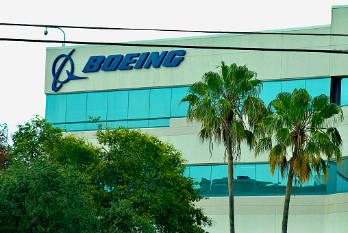 Titusville, Florida, USA - May 21, 2023: Palm trees grow in front of The Boeing Company’s Space Coast building near the Kennedy Space Center and Cape Canaveral Space Force Station.