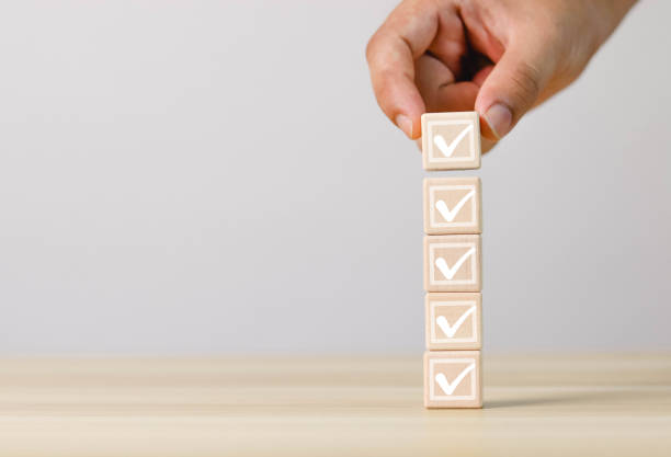 istock Wooden block with checkmark checklist lined up 1492779215