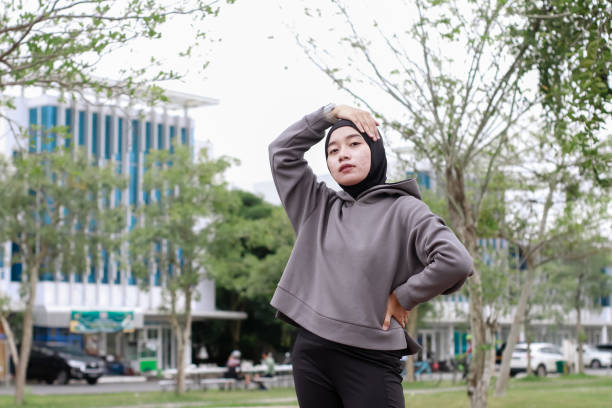istock asian young muslim female excercise at park 1492780461
