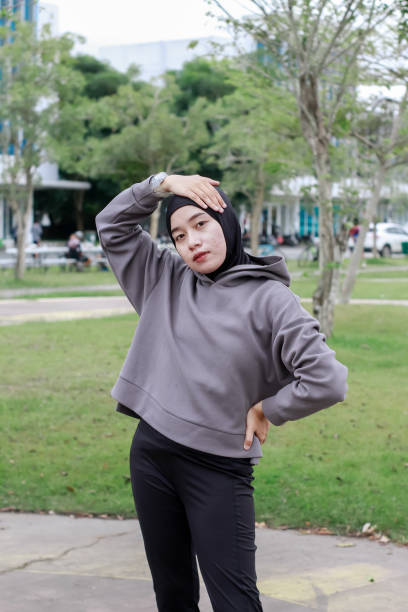 istock asian young muslim female excercise at park 1492780462