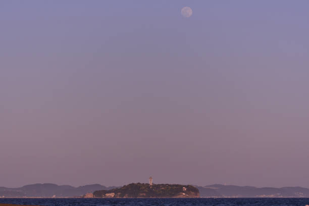 istock Full moon rising over Enoshima at dusk. 1492782266