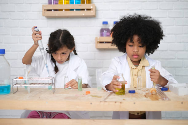 istock Children doing chemical experiments in school laboratories, science students, experiment, observation and curiosity concept. The first step of becoming a scientist 1492782268