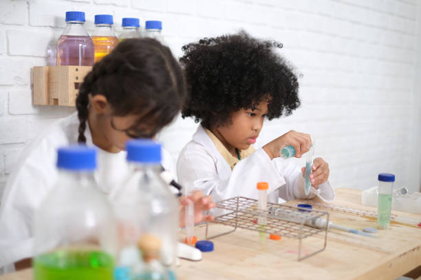 istock Children doing chemical experiments in school laboratories, science students, experiment, observation and curiosity concept. The first step of becoming a scientist 1492782323