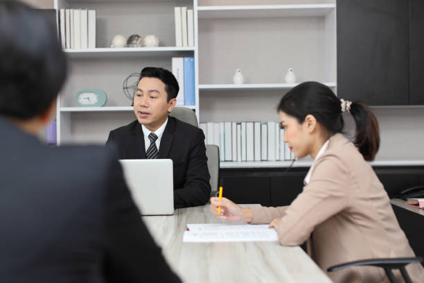 istock Collaborative process of professional businesspeople going over on new project together, using computer presentation and brainstorming ideas, coworker and working together at office meeting concept 1492790276