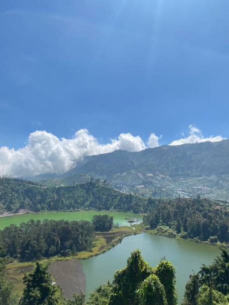 istock Panoramic view of nature with lake and mountain under the sky 1492790447