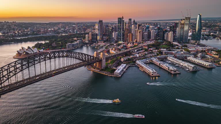 4K Aerial view Hyper lapse Footage of above Sydney Harbour Bridge, Circular Quay, Opera House and Sydney Daring Habor Office and Luxury Building group