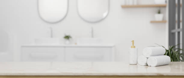 istock Empty space on a luxury white tabletop in a luxury white bathroom with double sink 1492797933