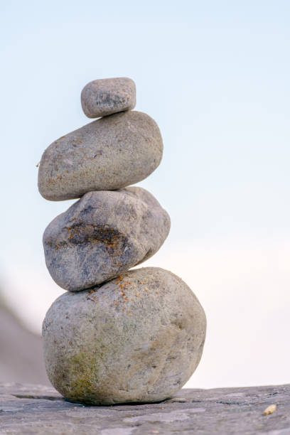 istock Pyramid of stones. Unstable balance of stone objects. 1492798016