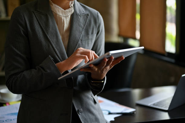 istock A businesswoman leaning on her table and using her digital tablet in the office. 1492798654