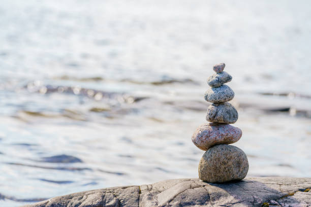istock Pyramid of stones. Unstable balance of stone objects. 1492798798