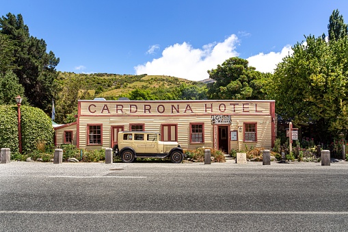 Cardrona, New Zealand – December 24, 2020: A close-up shot of a car parked in front of the Cardona Hotel on a city street in New Zealand